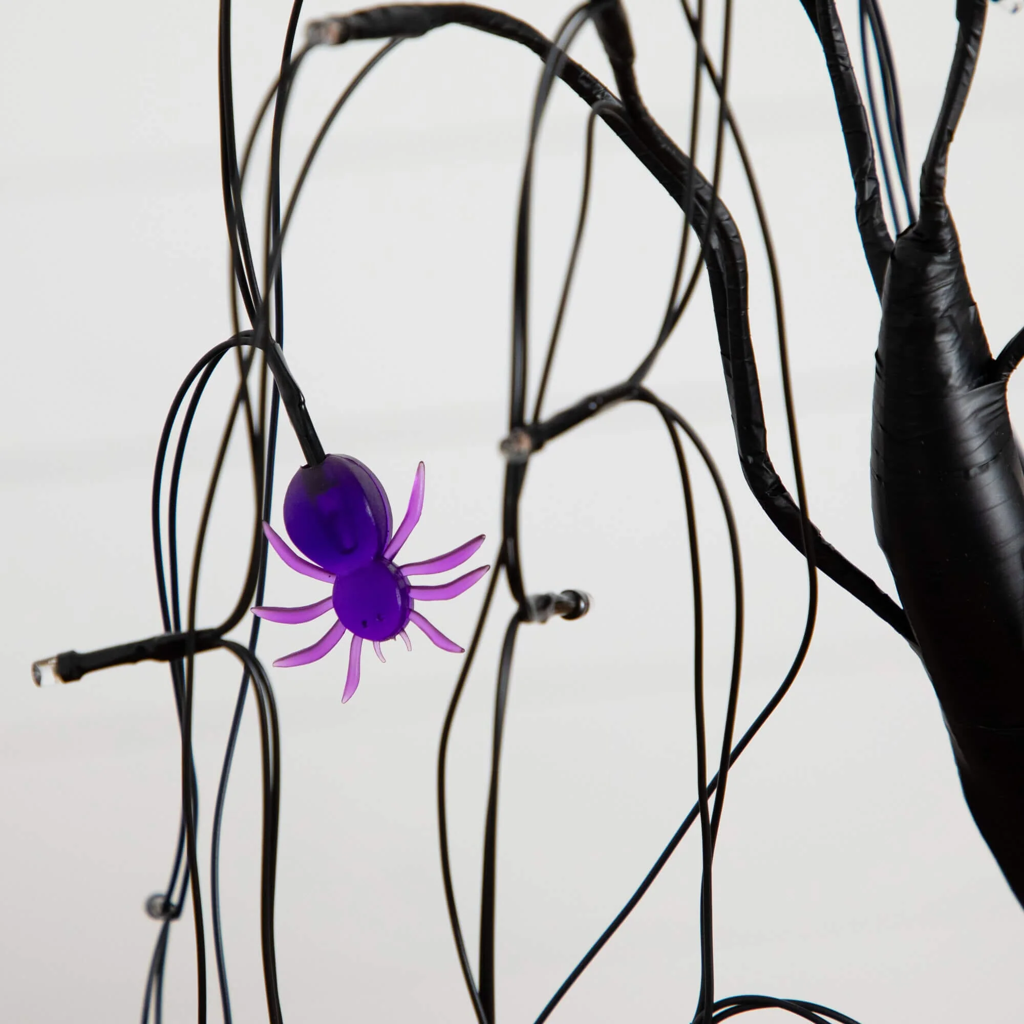 2' Pre-Lit Halloween Artificial Black Spooky Spider Willow Tree with 60 Orange & Purple LED Lights - Image 5